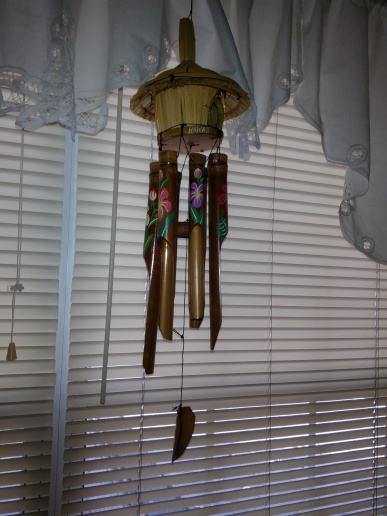 Wind chimes made of wood in bedroom window